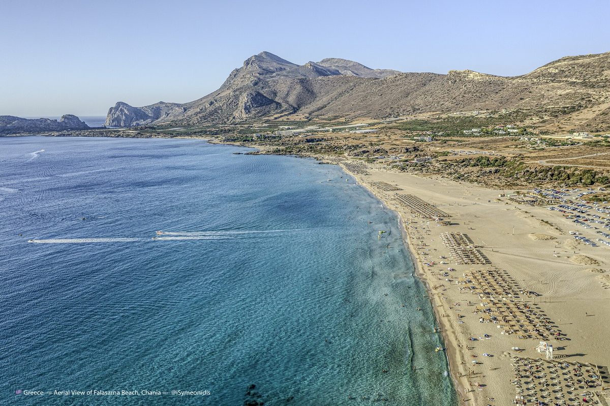Aerial view of the long sandy beach and turquoise water of Falasarna, Crete